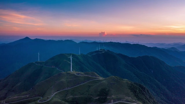 日落晚霞环绕航拍风车山视频素材