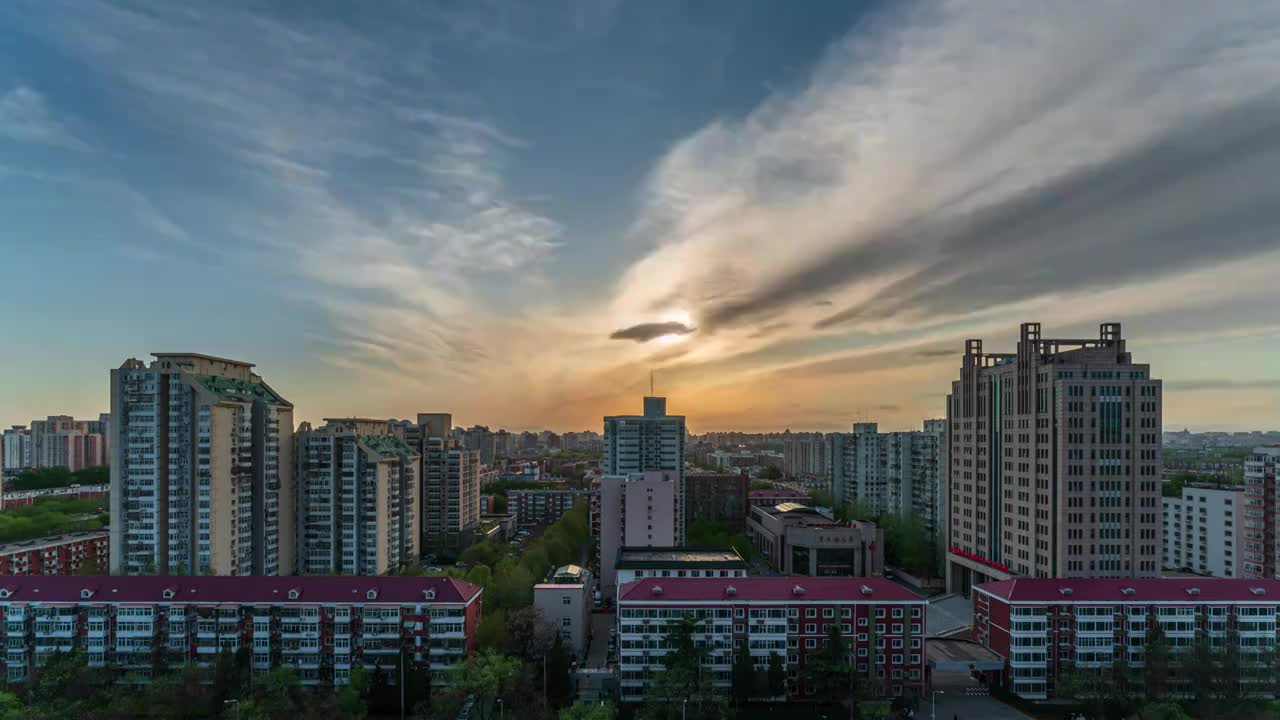 傍晚北京城市天际线流云彩霞的日转夜延时视频素材