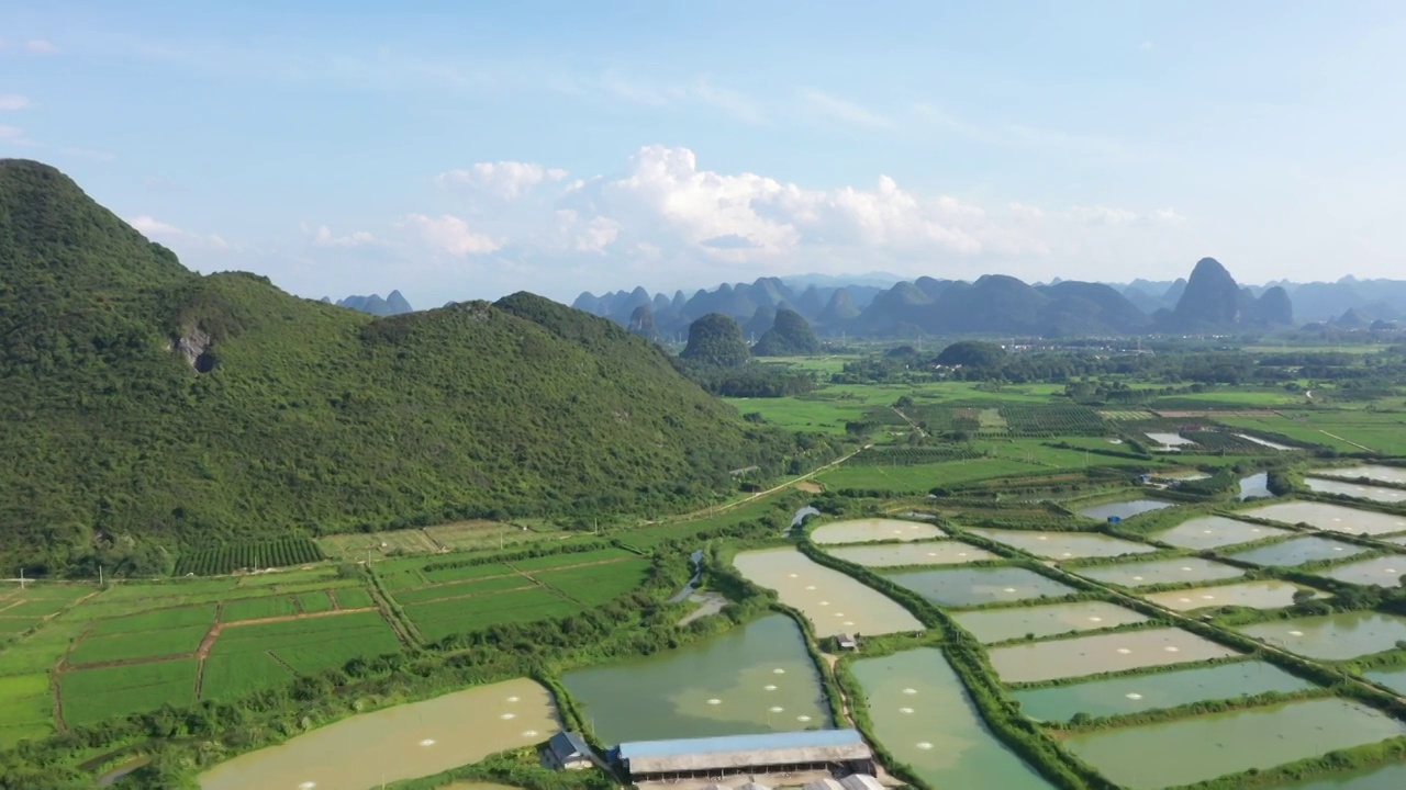 蓝天白云下桂林山间大片的鱼塘视频素材