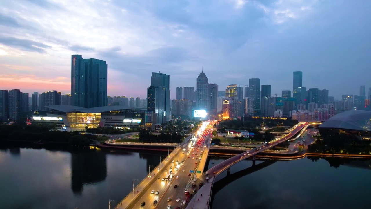 中国辽宁沈阳盛京剧院和浑河大桥车流建筑航拍夜景视频素材