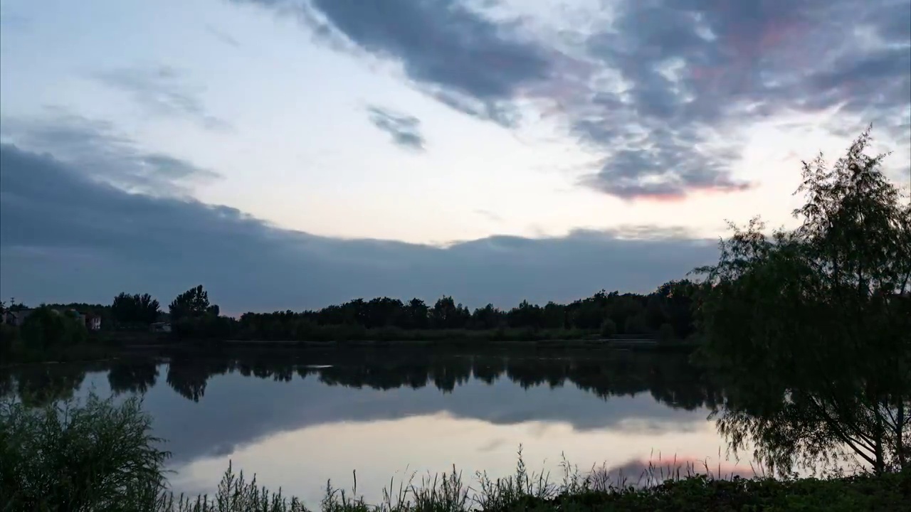 沈阳蒲河河岸边黄昏夕阳日转夜延时视频素材