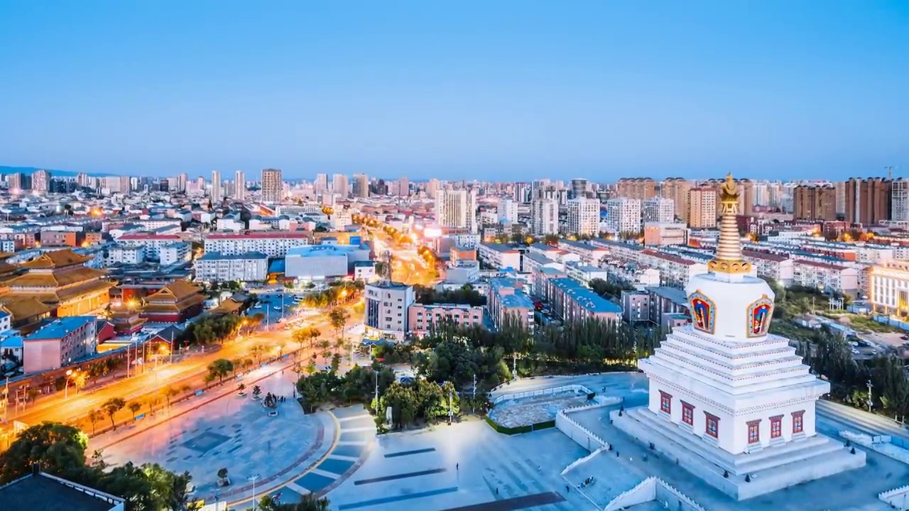 内蒙古呼和浩特市宝尔汗佛塔和观音寺夜景航拍延时摄影视频素材