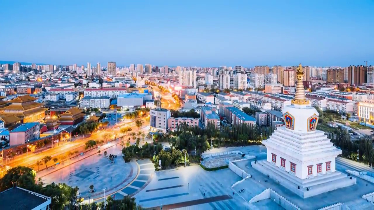 内蒙古呼和浩特市宝尔汗佛塔和观音寺夜景航拍延时摄影视频素材