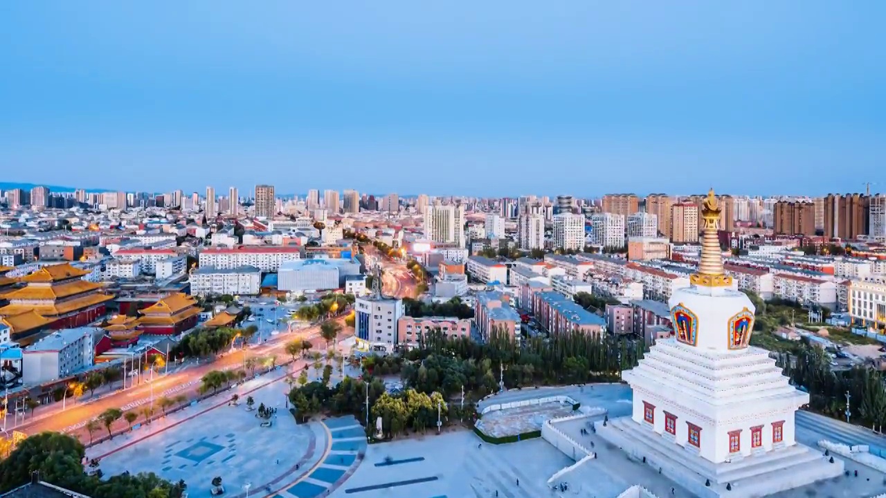 内蒙古呼和浩特市宝尔汗佛塔和观音寺夜景航拍延时摄影视频素材