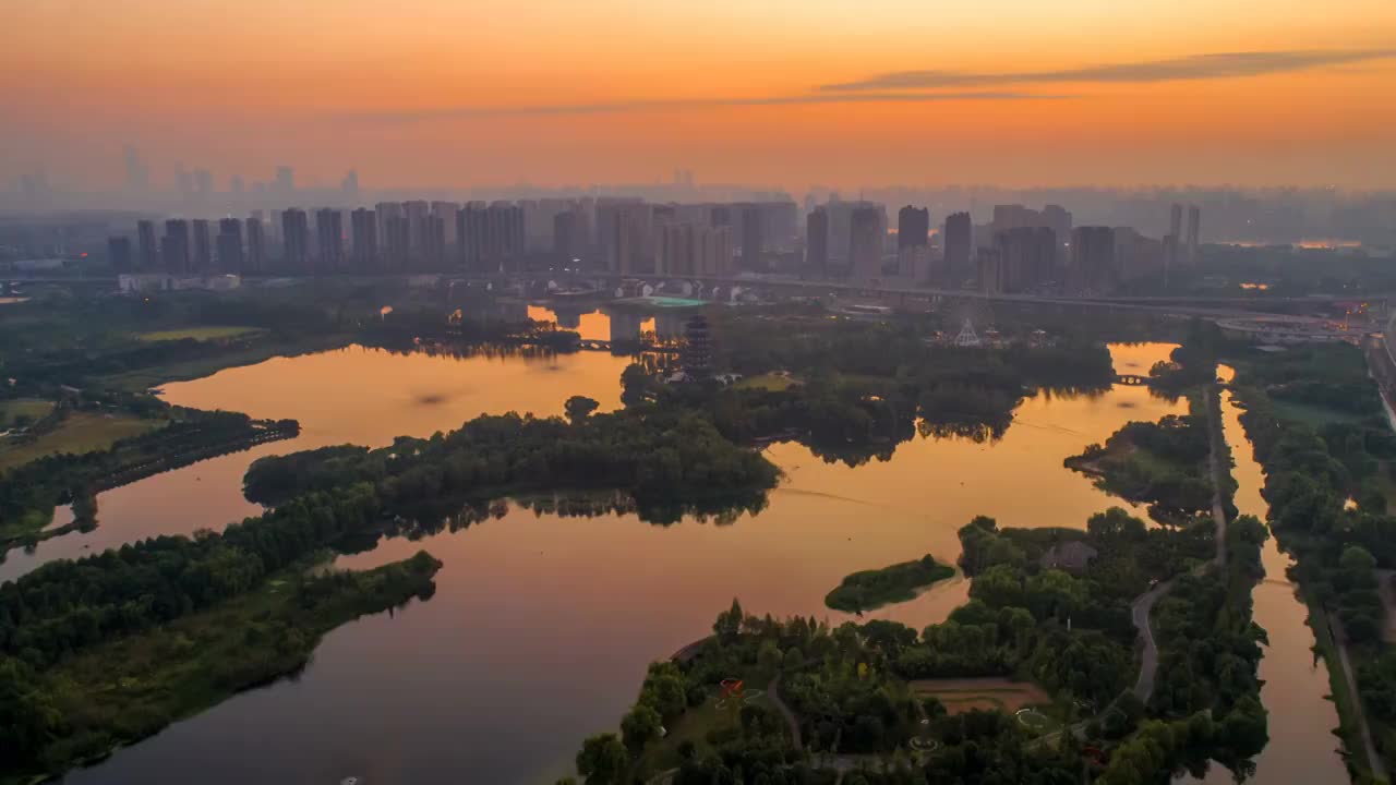 长沙市洋湖朝湿地朝霞日出航拍延时摄影视频素材