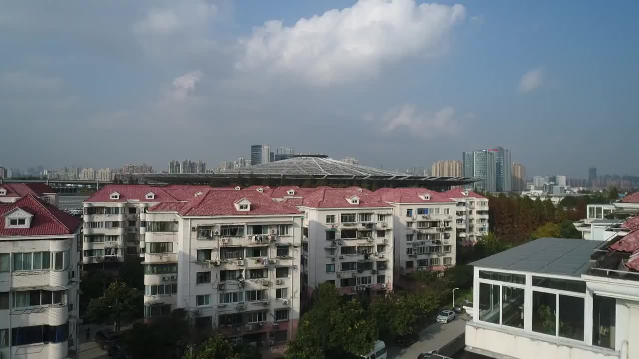 航拍的上海城市旅游交通地标建筑景观—上海铁路南站视频素材