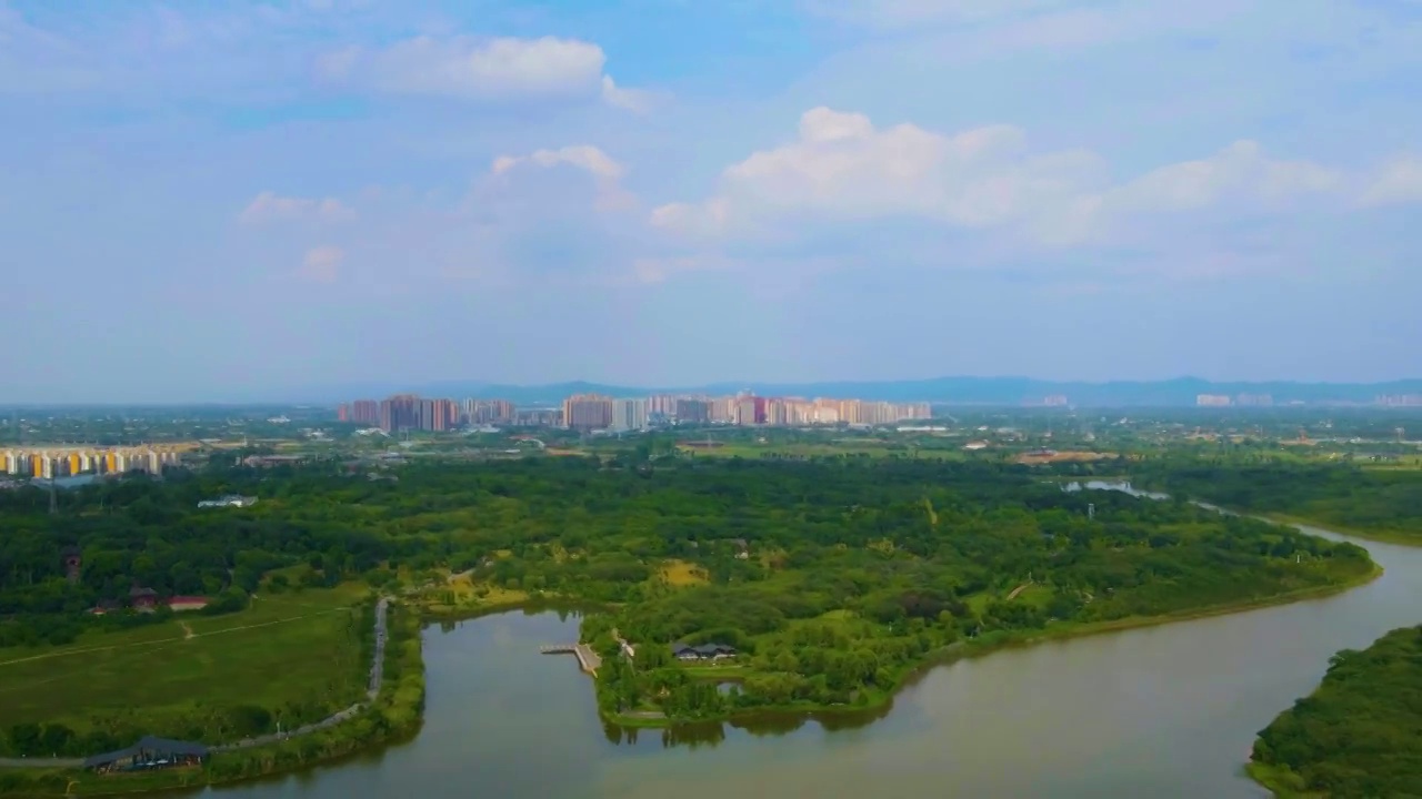 航拍成都清澈的蓝天白云青龙湖湿地公园城市水域视频素材