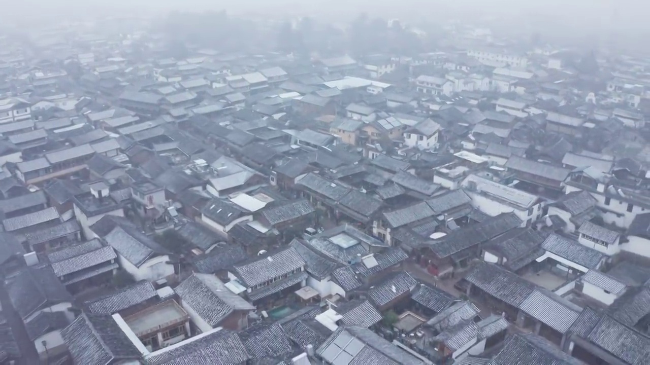 云南丽江古城白沙古镇雪天航拍视频素材