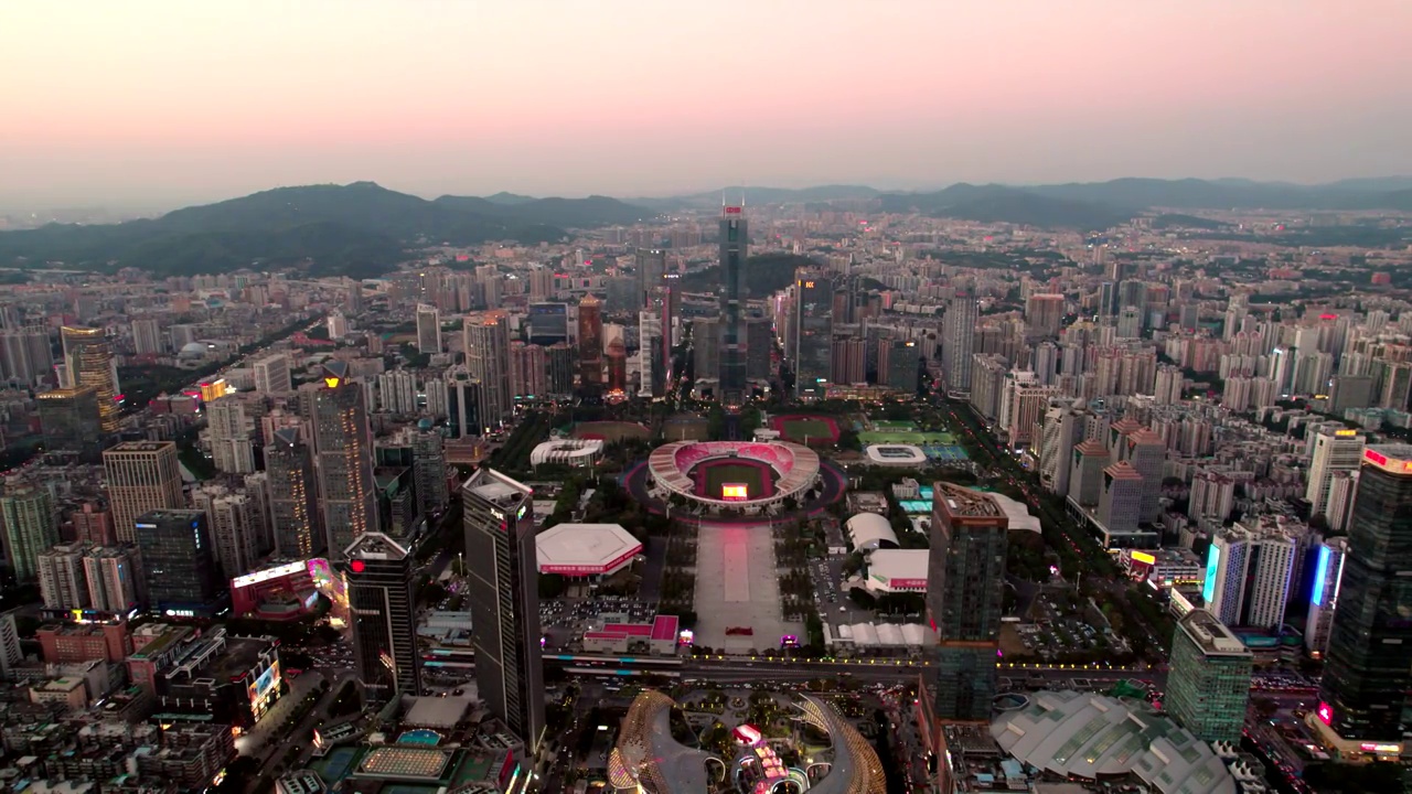 广东广州中信广场和前面的体育中心体育馆夜景视频素材