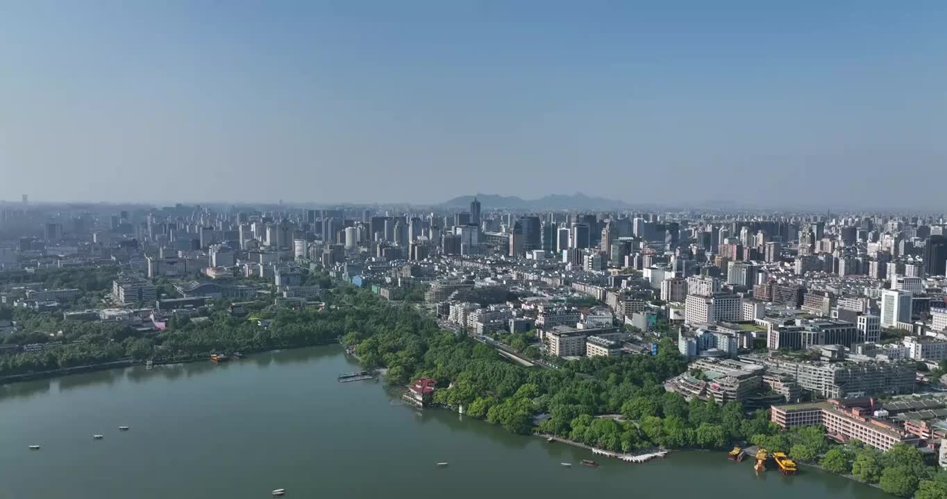 航拍杭州西湖畔的城市天际线全景白昼风光视频素材