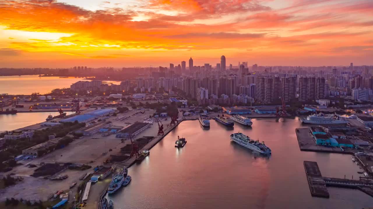 中国海南省海口市城市天际线港口日出航拍延时摄影视频下载