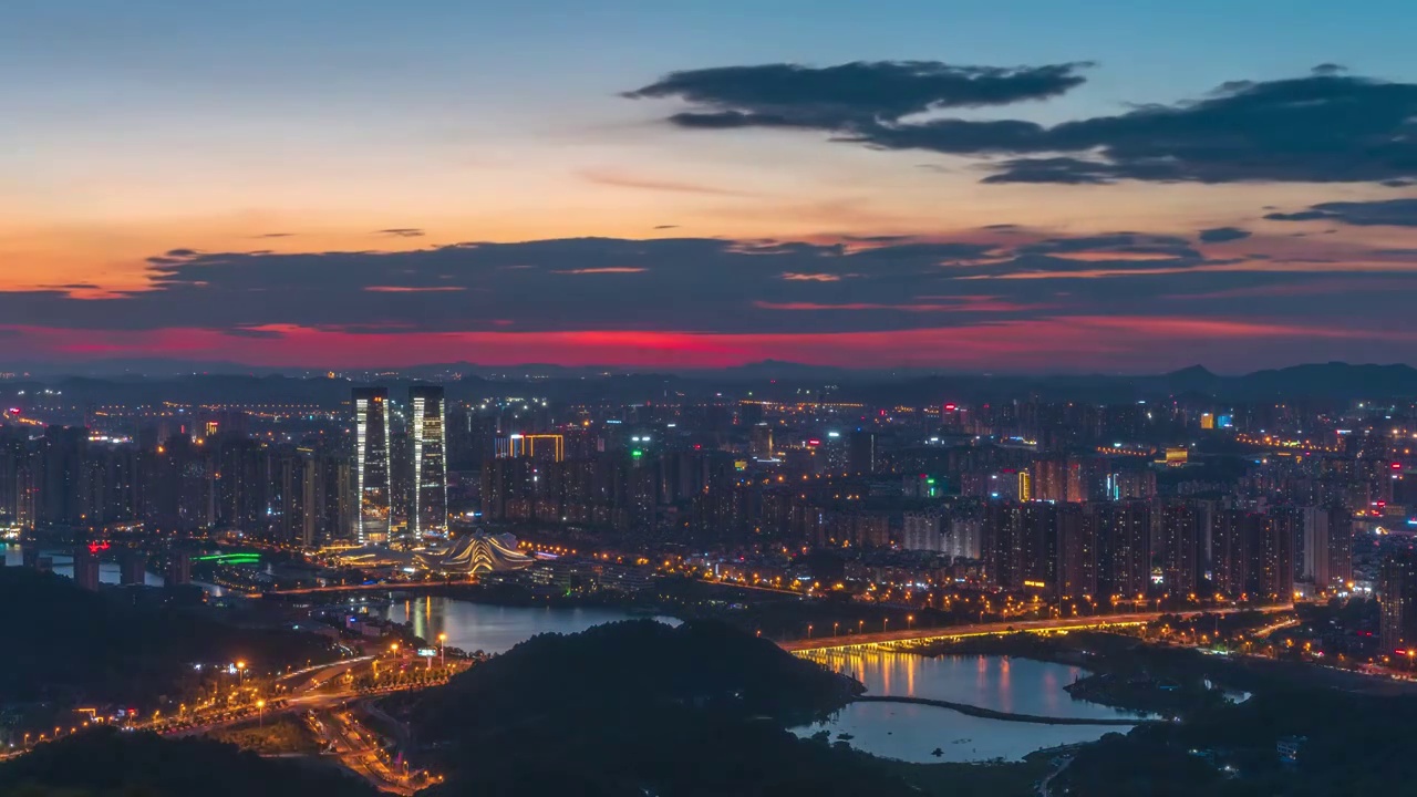 湖南省长沙市梅溪湖晚霞延时，梅溪湖大剧院日转夜延时视频素材