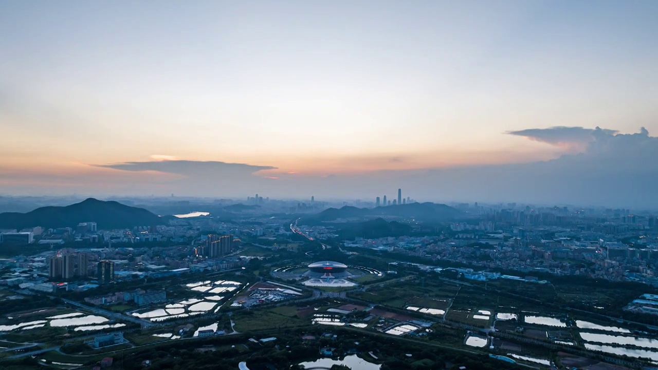 广东东莞银行篮球中心黄昏转夜景航拍延时视频素材