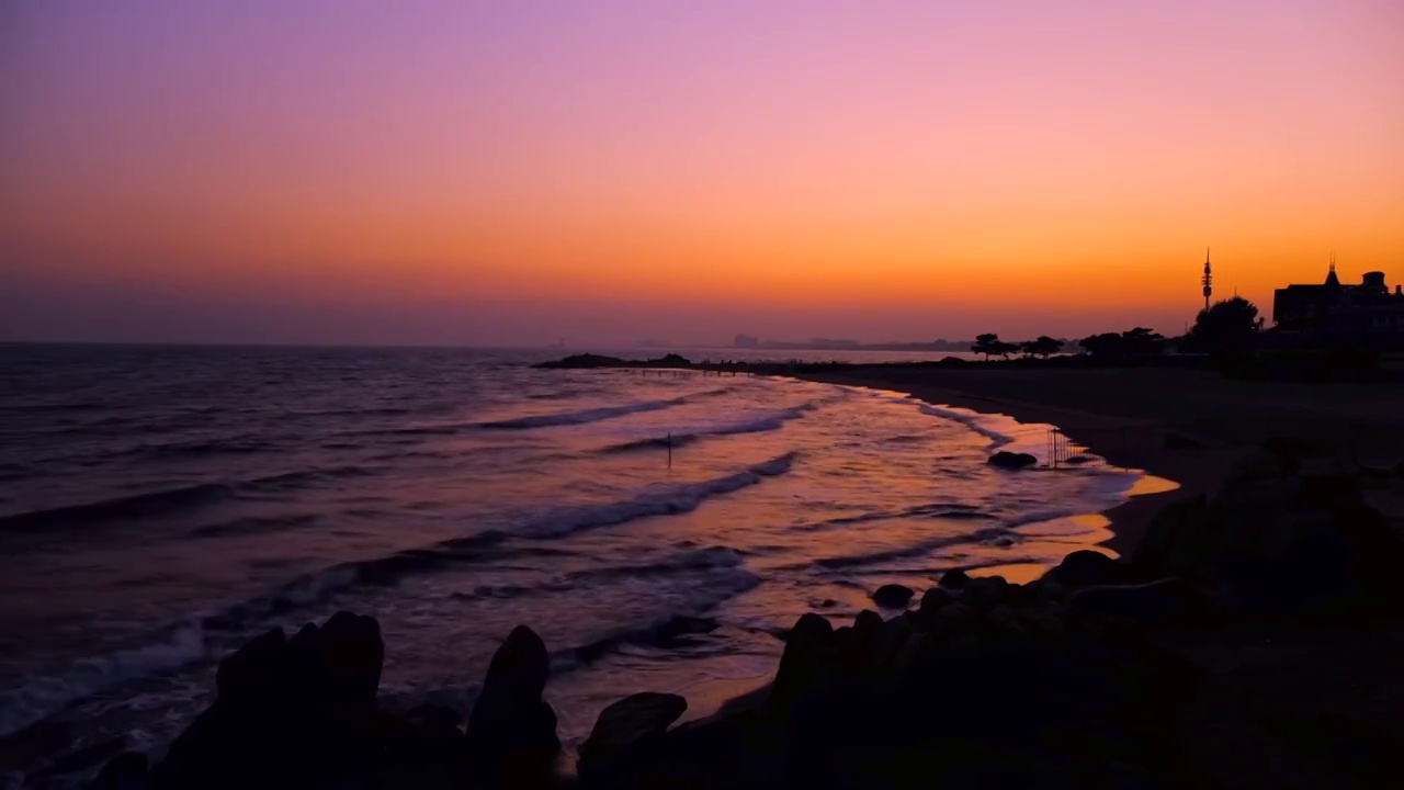 秦皇岛滨海沙滩夕阳日落自然风光视频素材