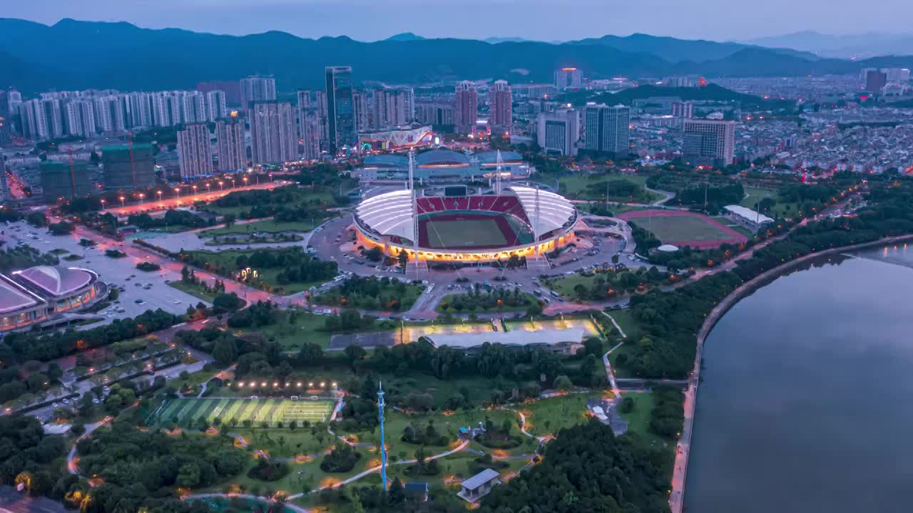 浙江义乌市体育场城市地标夜景车流航拍延时摄影视频素材