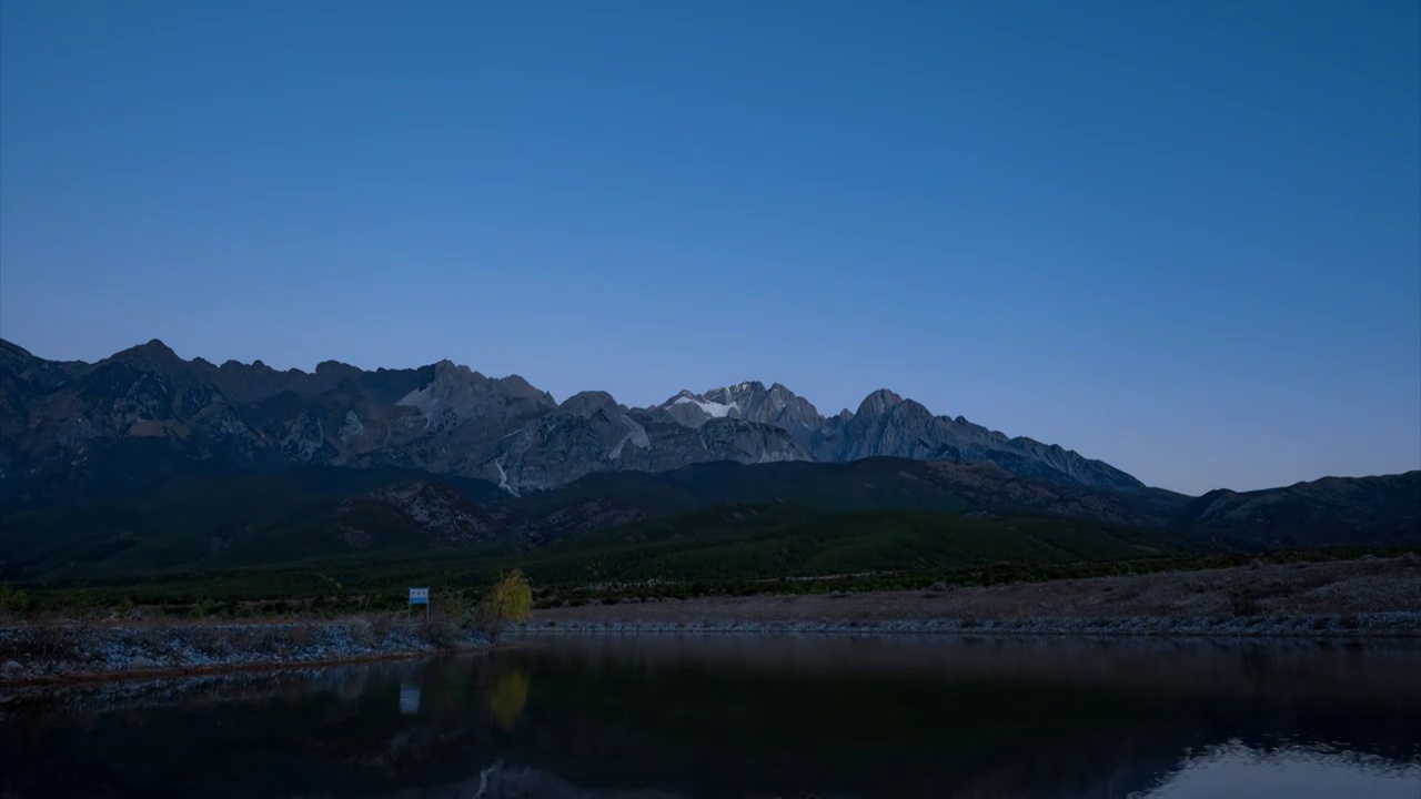 玉龙雪山星空日照金山延时视频素材