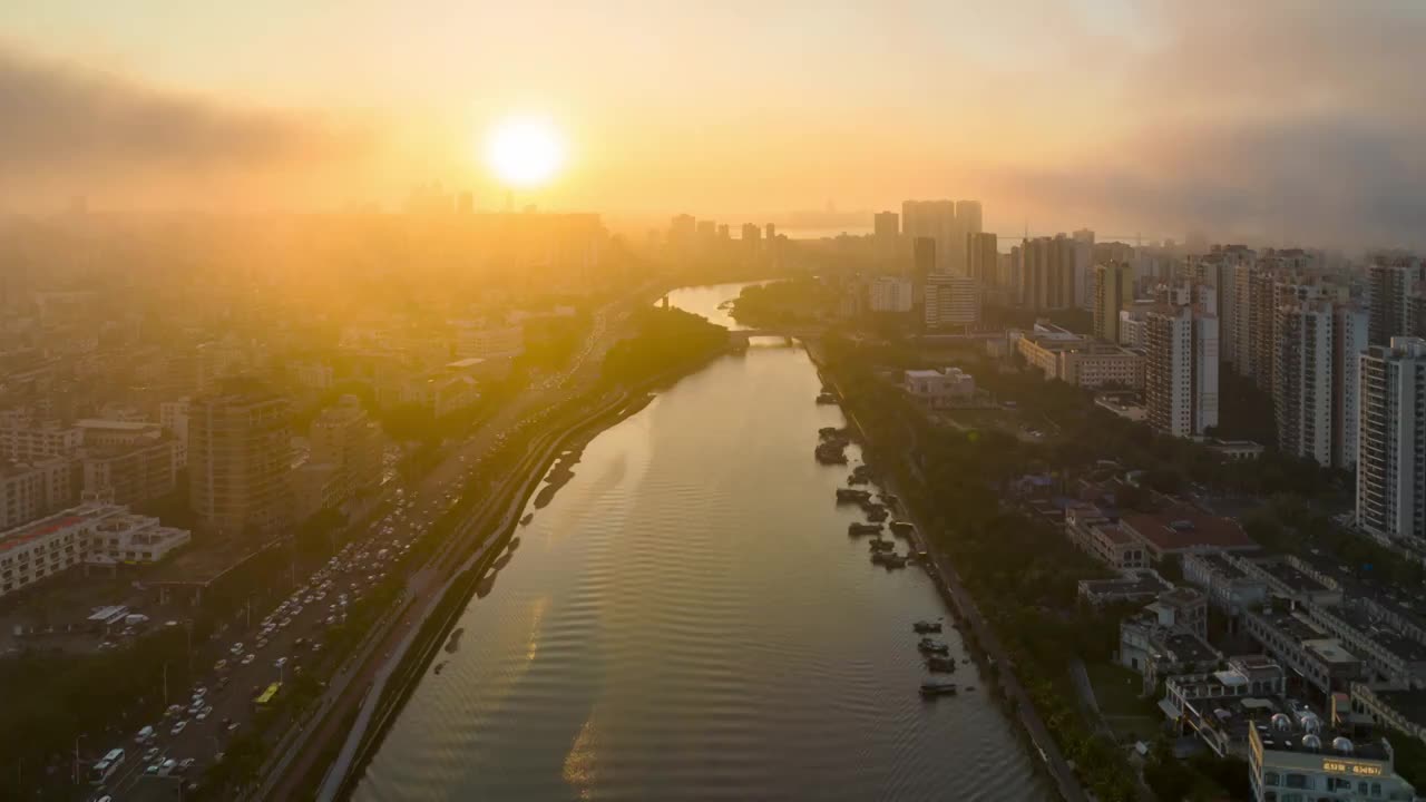 航拍海口市区海甸河落日延迟视频素材