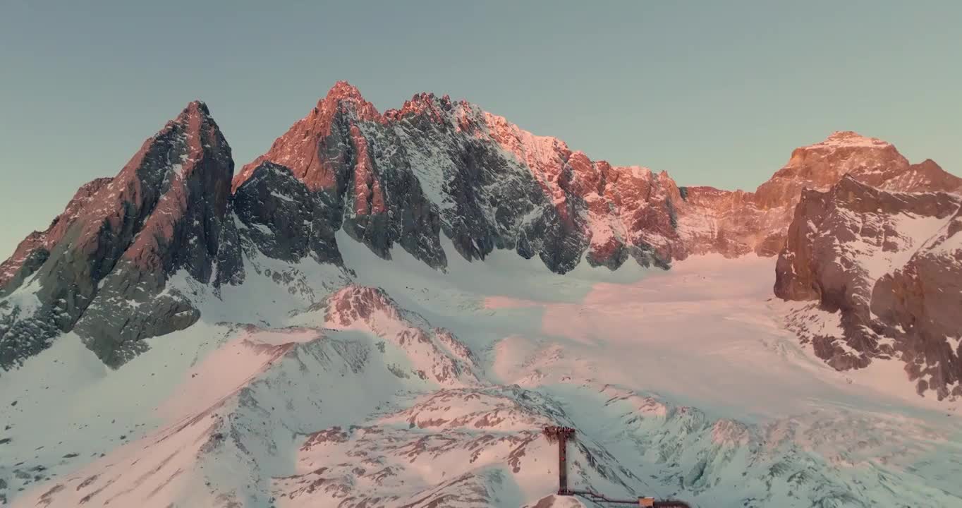 航拍空中远眺云南丽江玉龙雪山日照金山风景视频素材