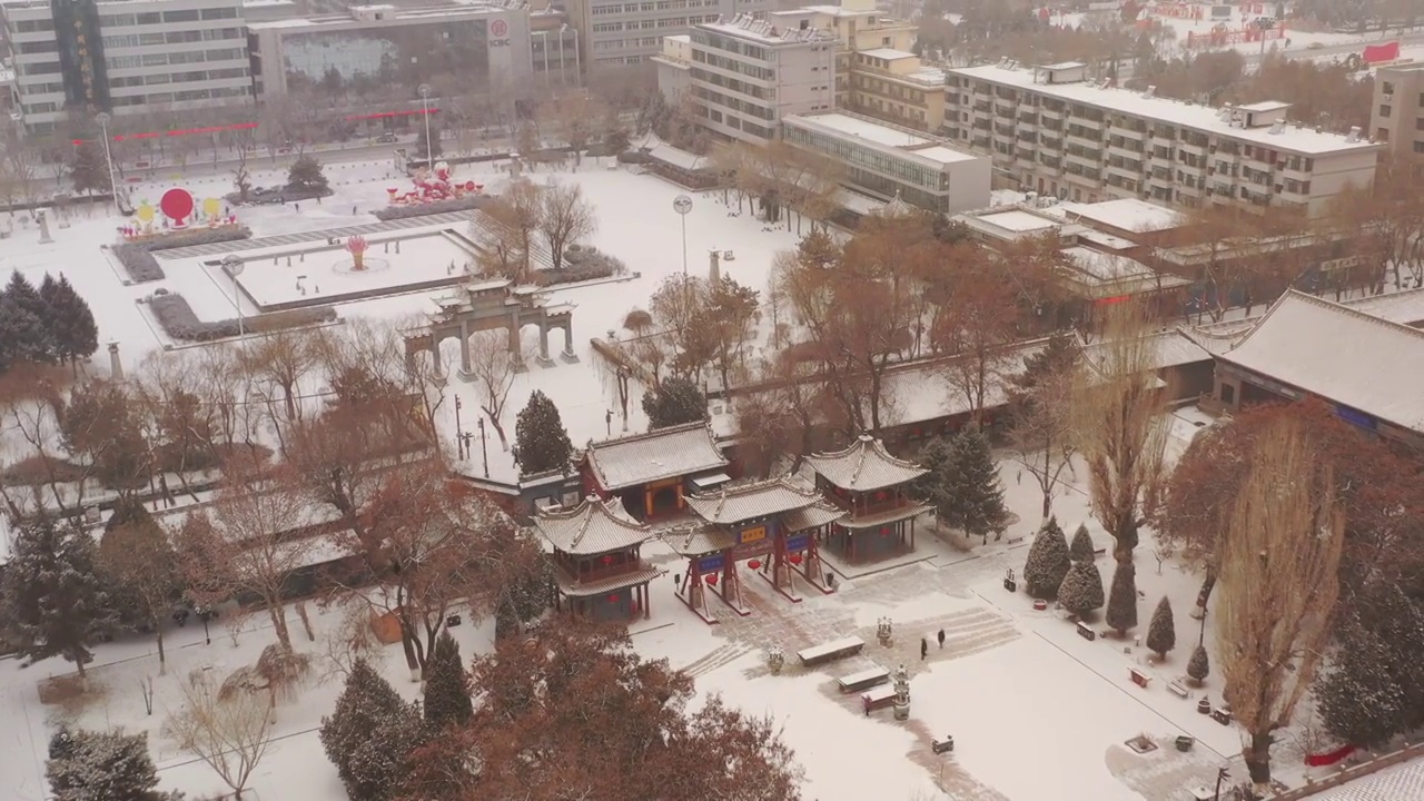 甘肃张掖土塔至大佛寺渐进航拍雪景20230213视频素材