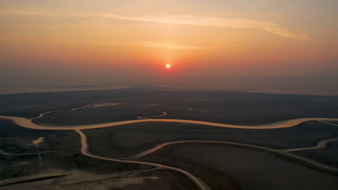 航拍黄河入海口湿地海上日出视频素材