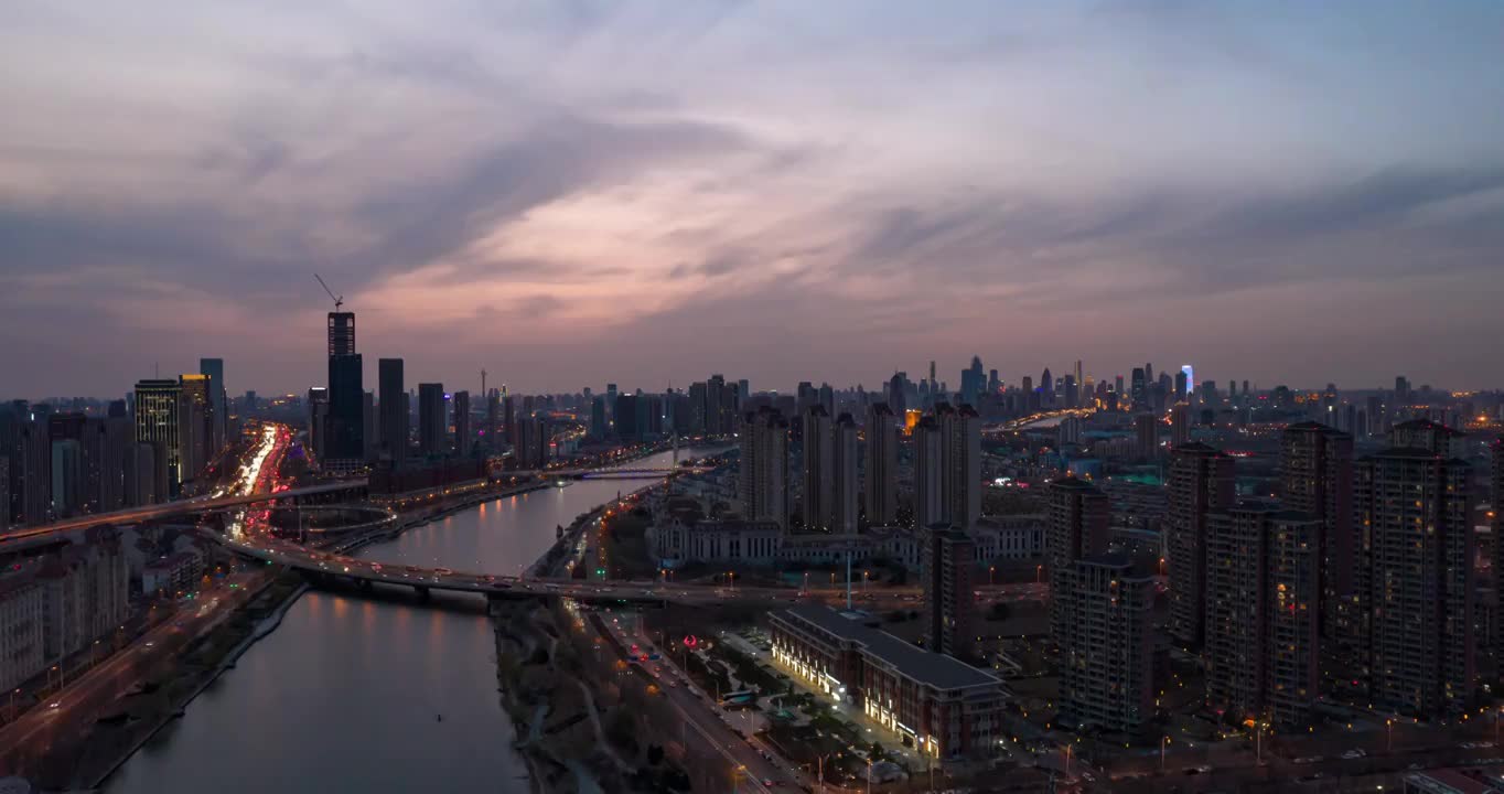 日落晚霞天津海河海津大桥城市夜景街道高空延时航拍视频素材