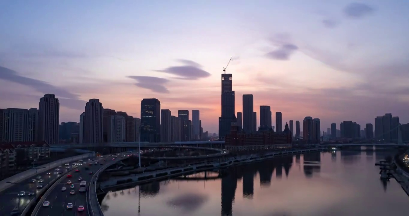 日落晚霞天津海河海津大桥城市夜景街道高空延时航拍视频素材