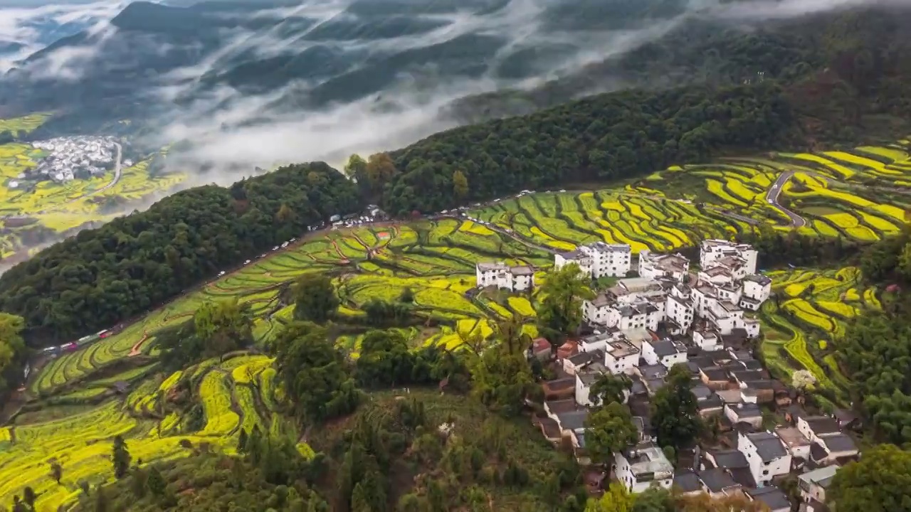 江西婺源江岭景区油菜花海云海风光航拍延时视频素材