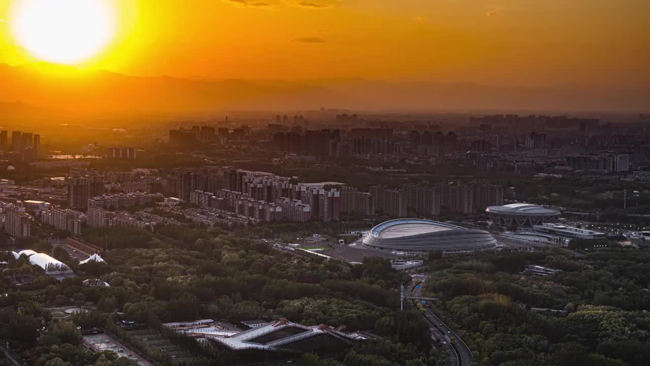 国家速滑馆冰丝带夕阳黄昏日专夜延时视频素材