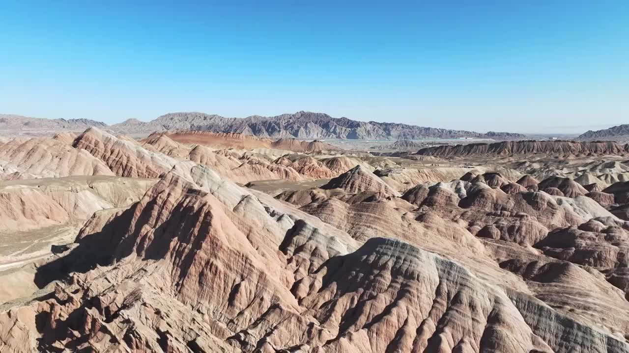 航拍蓝天下的甘肃张掖七彩丹霞自然风光视频素材