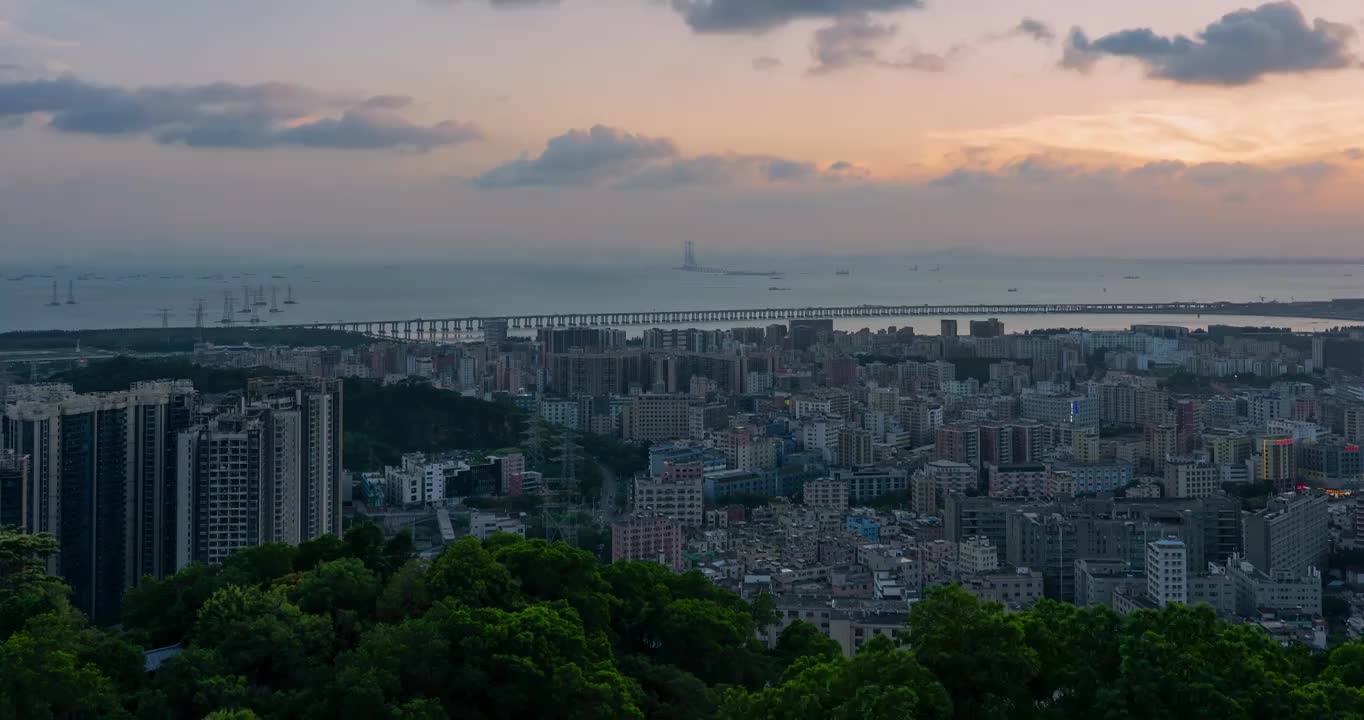 广东深圳宝安西乡城中村深中通道海上日落夕阳晚霞延时视频素材