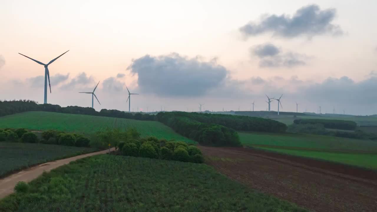 湛江徐闻县菠萝的海日落风车航拍景观视频素材