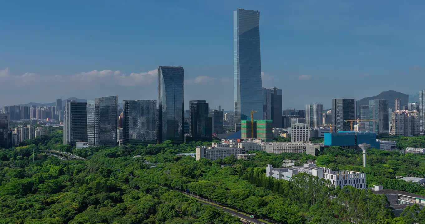 广东深圳南山城市地标建筑群汉京大厦等绿色生态蓝天白云水平视角延时视频素材