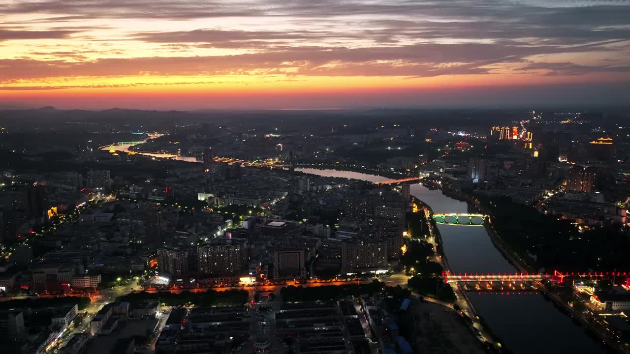 4K河南信阳浉河日落夜景晚霞城市天际线航拍俯瞰视频素材