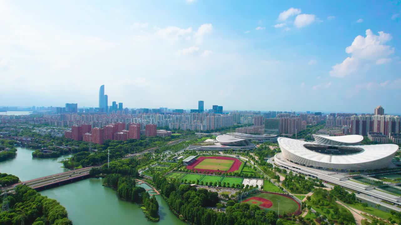 无人机航拍水晶蓝色天空背景苏州奥体中心视频素材