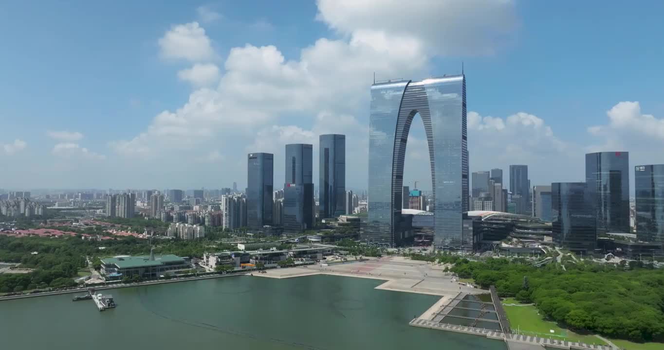 蓝天白云下的江苏省苏州市金鸡湖风景区城市建筑东方之门航拍风光视频素材