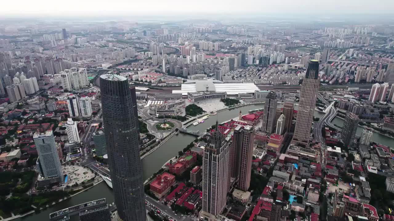 天津津湾海河沿岸商务金融中心城市建筑日落风光航拍视频素材