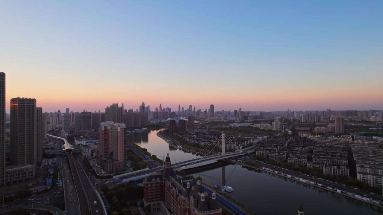 天津海河富民桥沿岸城市建筑日落风光航拍视频素材