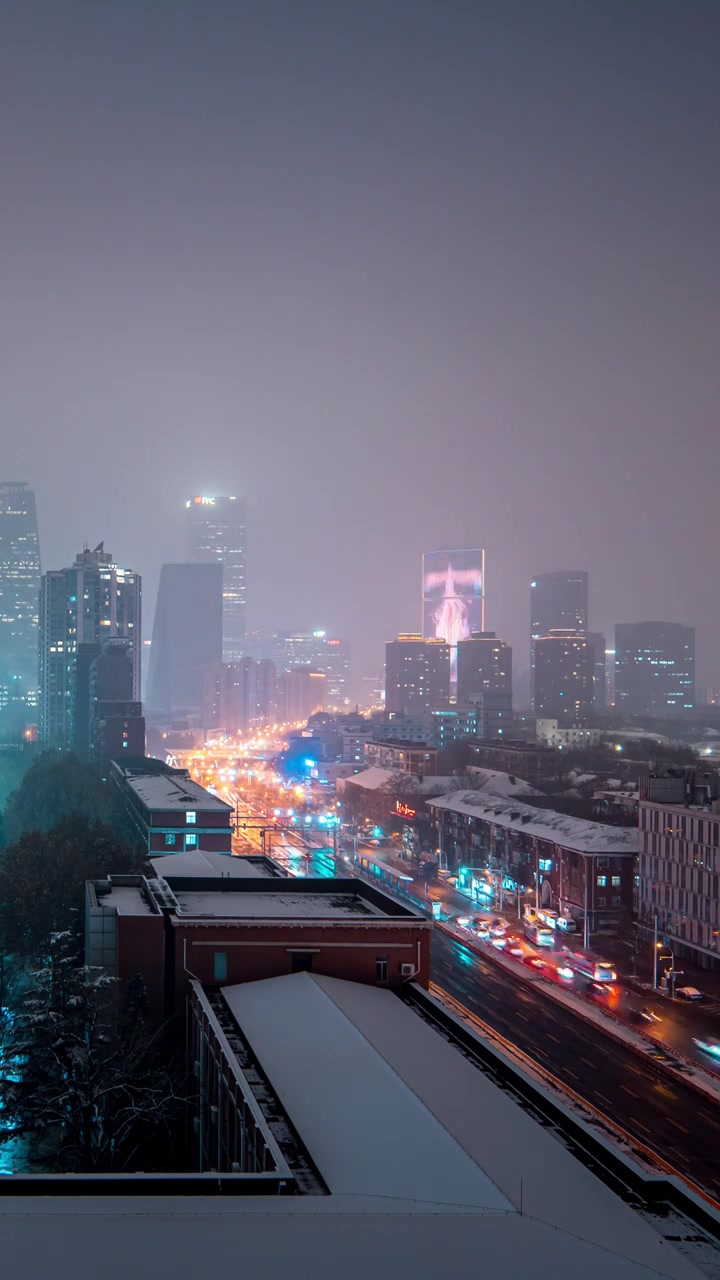 鸟瞰北京国贸CBD雪景夜晚视频素材