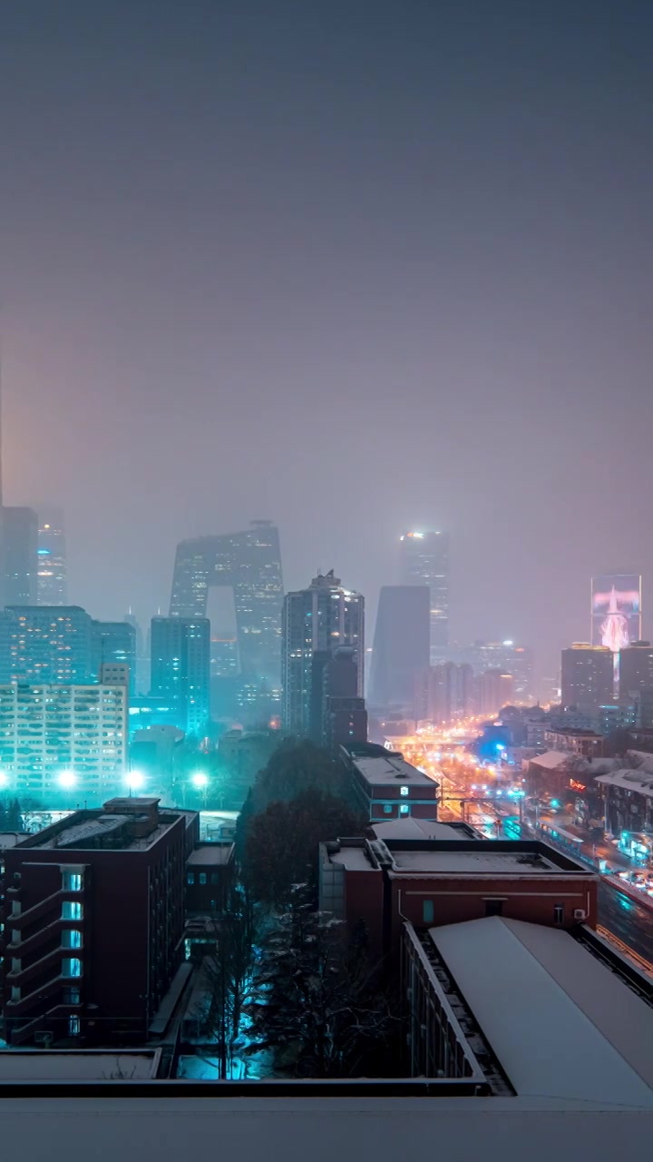 鸟瞰北京国贸CBD雪景夜晚视频素材