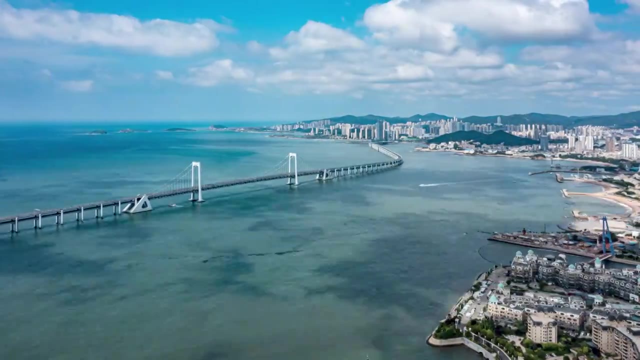 大连高新园区星海湾大桥航拍延时蓝天白视频素材