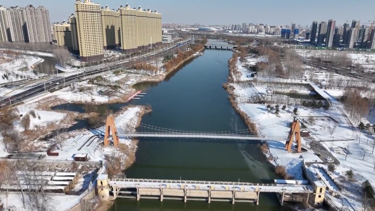 雪后的徒骇河与京杭运河交汇处+山东省聊城市东昌府区四河头水利遗址公园视频下载