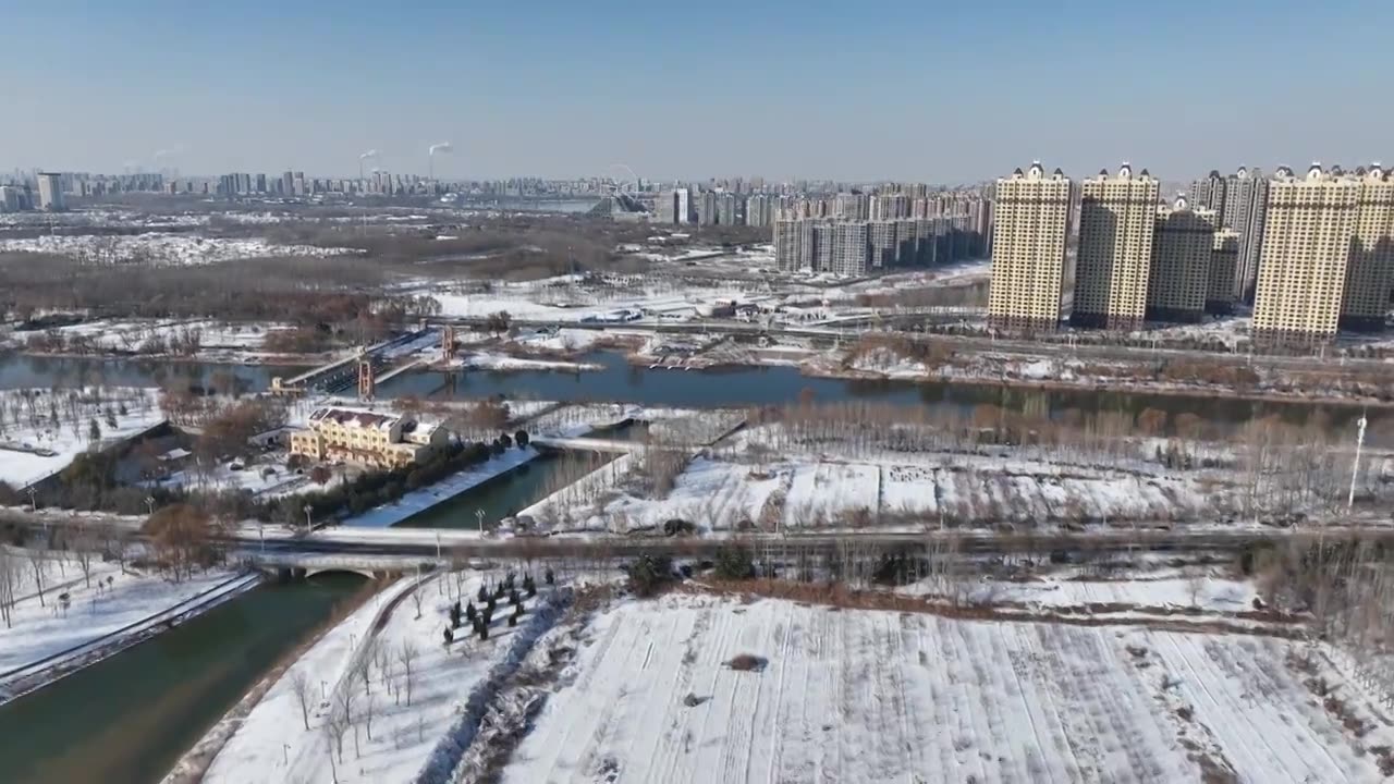 雪后的徒骇河与京杭运河交汇处+山东省聊城市东昌府区四河头水利遗址公园视频素材