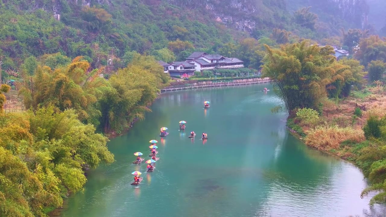 航拍春天广西桂林阳朔遇龙河竹筏漂流视频素材