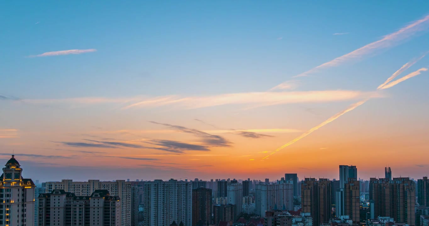 武汉光谷城市天空日出日落彩霞粉色火烧云航拍延时视频素材