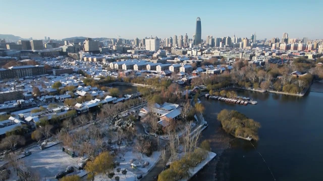 4K济南大明湖雪景眺望泉城广场CBD航拍视频视频素材