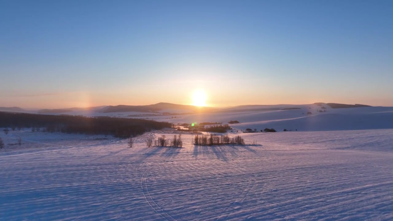 航拍内蒙古冬季雪原灿烂夕阳视频下载