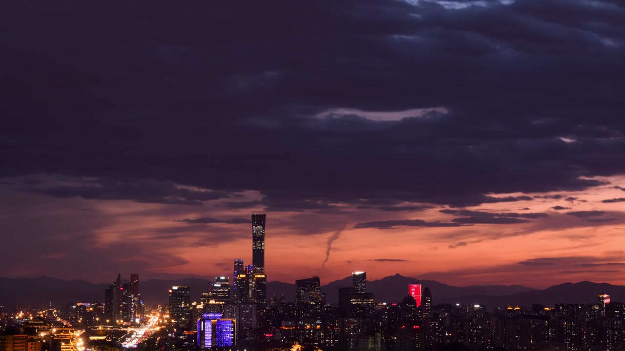 航拍晚霞火烧云北京CBD地标建筑全景延时视频素材