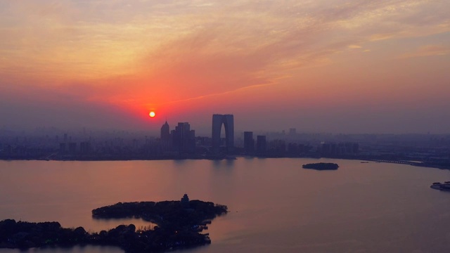 航拍日落时分的苏州金鸡湖城市风光视频素材