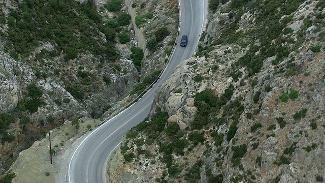 WS AERIAL TS View over long street in mountains / Karpathos, Dodecanese，希腊视频素材