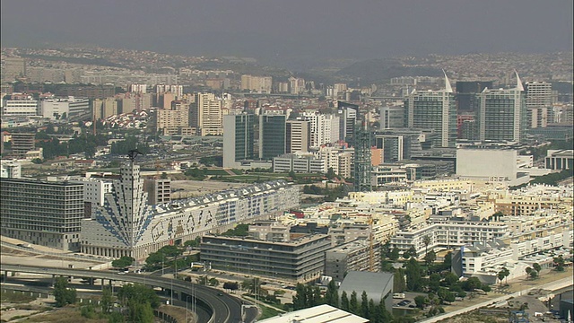 AERIAL WS Cityscape with park das Nacoes /葡萄牙里斯本视频素材